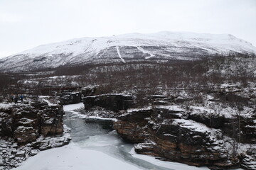 mountain river in winter in Abisko in Sweden