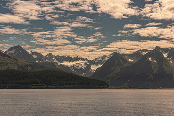 Seward, Alaska, USA - July 22, 2011: Wide landscape of Resurrection bay shoreline with snow covered...
