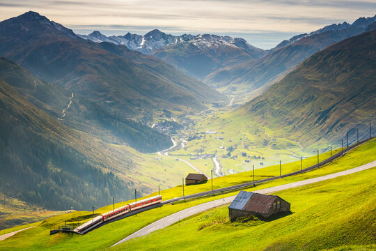 Swiss train in the idyllic alps around Andermatt, Uri, Switzerland