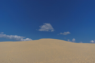 Sand dune and blue cloudy sky, Dune du Pilat, Arcachon, Nouvelle-Aquitaine, France
