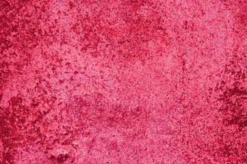 background, texture of concrete and stone in the color of 2023 viva magenta. High quality photo