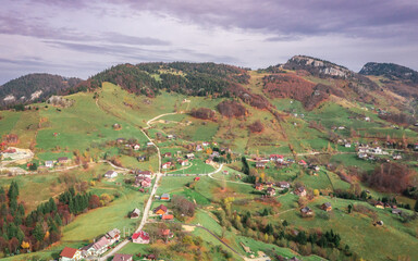 Beautiful landscape aerial view with Carpathian Mountains in Brasov county Romania captured in autumn 
