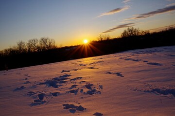 Sunset on Christmas Day Over a Snow Covered Field