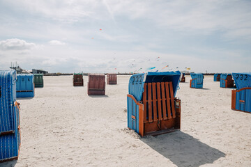 Beach chair on the North Sea beach between the dunes. Vacation in Germany at the North Sea. north...