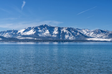 Snow Covered Desolation Wilderness Peaks and Lake Tahoe from Nevada Beach