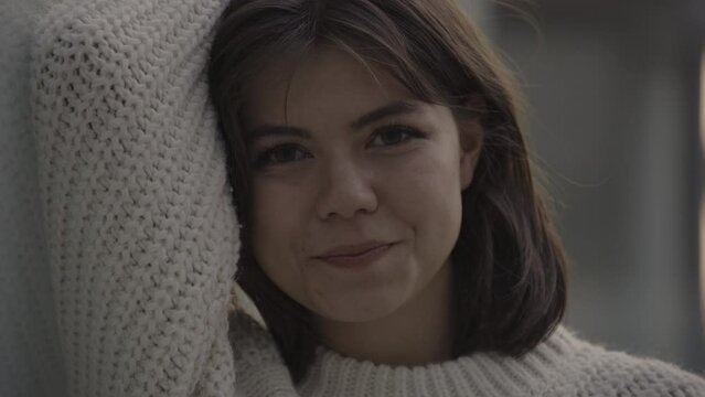 Close up portrait of smiling woman leaning on raised arm / Provo, Utah, United States