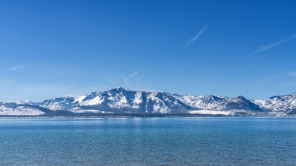 Snow Covered Peaks of Desolation Wilderness and  Lake Tahoe from Nevada Beach
