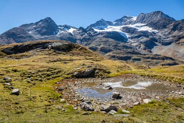 Fototapeta na wymiar Bernina and Palu mountain range with lake in the Alps, Engadine, Switzerland