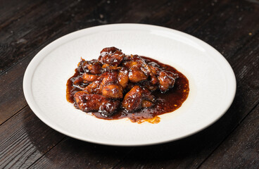 Teriyaki chicken nuggets on a dark background