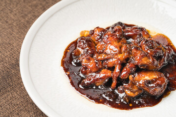 Teriyaki chicken nuggets on a dark background