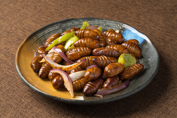 Stir-fried cocoon pupae is a special food in northeast China