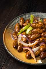 Stir-fried cocoon pupae is a special food in northeast China