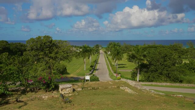 Park on the Caribbean Sea, Montego Bay, Jamaica. The territory of ROSE HALL GREAT HOUSE. Sky with lonely clouds.