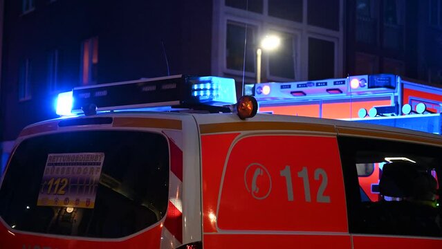 Ambulance with flashing lights at night. Emergency vehicle.