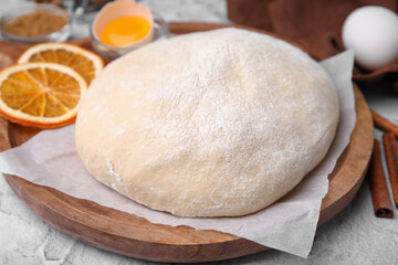 Fresh dough and ingredients on white table, closeup
