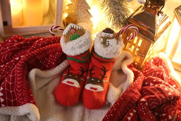 Stockings with sweets on plaid. Saint Nicholas Day tradition