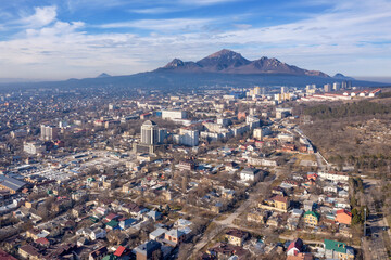 Fototapeta na wymiar Aerial view of Pyatigorsk town and Mount Bestau on sunny winter day. Stavropol Krai, Russia.