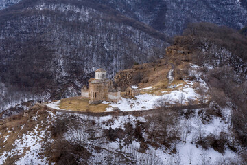 Drone view of Senty temple on cloudy winter day. Nizhnyaya Teberda village, Karachay-Cherkessia, Russia.