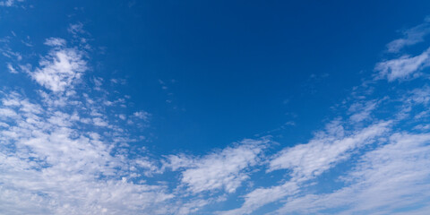 Naklejka na ściany i meble Blue sky with a white cloud background