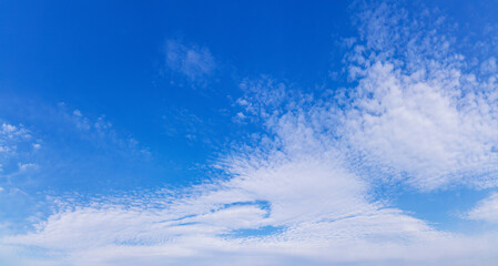 Naklejka na ściany i meble Blue sky with a white cloud background