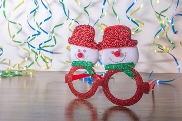 Christmas ocules with a ribbon clothesline in the background with the colors of Brazil, festive concept of Brazilian Christmas