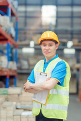 Portrait asian engineer in helmets order on tablet for checking goods and supplies on shelves with goods background in warehouse.logistic  business export ,Warehouse worker checking packages on store