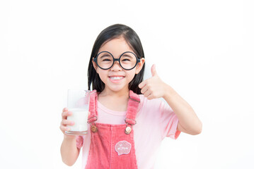 child asia girl  drink milk with a glass
