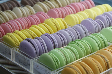 Colorful macarons on display with different flavors