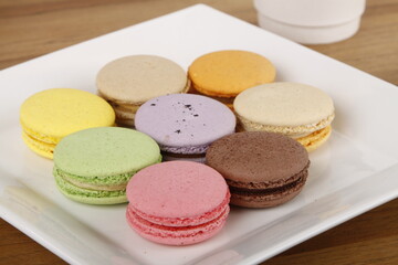 Colorful macarons on display with different flavors