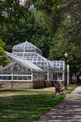 Fototapeta na wymiar Impressive glasshouse in a garden, Toronto, ON, Canada