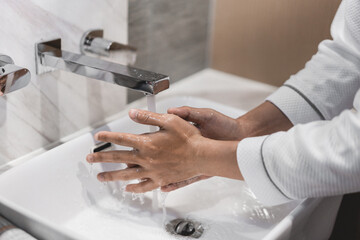 Close up of people washing hand carefully.