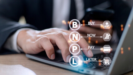 Businessmen holding a smartphone with icons of BNPL with online shopping icons technology. BNPL Buy now pay later online shopping concept.