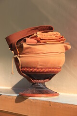 Monk's alms bowl: Put it on the table to offer food to monks at the funeral according to Thai tradition