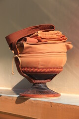 Monk's alms bowl: Put it on the table to offer food to monks at the funeral according to Thai tradition