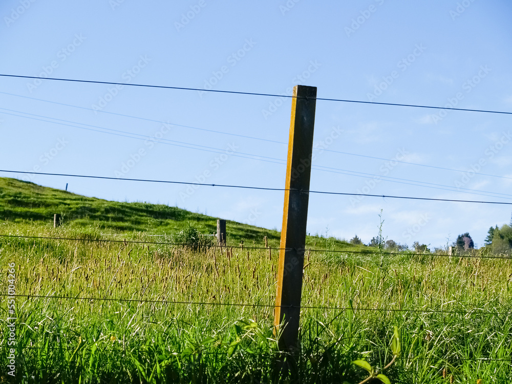 Sticker Rural background though wire fence