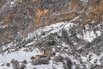 View of ruins of old Ingush settlement Keli on sunny winter day. Ingushetia, Caucasus, Russia.