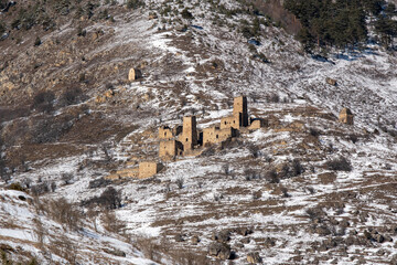 Ruins of old Ingush settlements Barkhane on sunny winter day. Ingushetia, Caucasus, Russia.