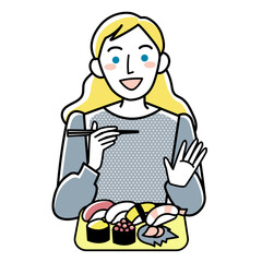 寿司を食べる外国人女性の上半身