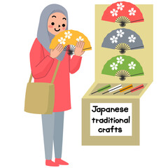 日本でお土産を選ぶアジア系外国人観光客の女性