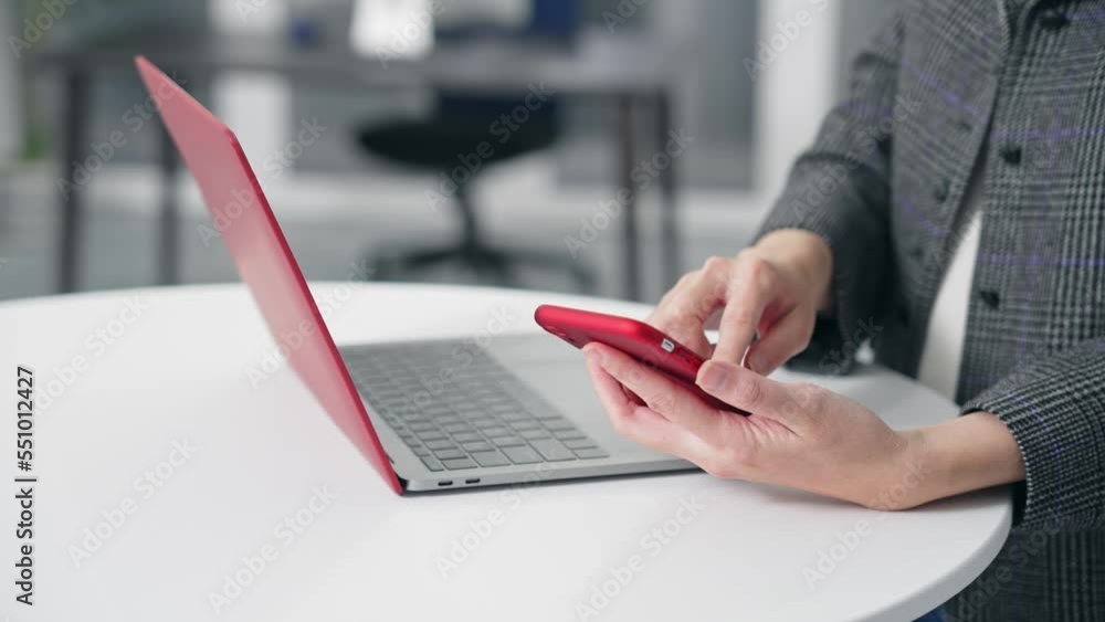 Poster woman using smartphone and laptop in office. smartphone authentication. biometric authentication. se