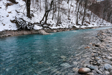 Mountain river on cloudy winter day. North Ossetia, Russia.