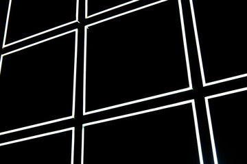 white led light strip on black wall form a square pattern.