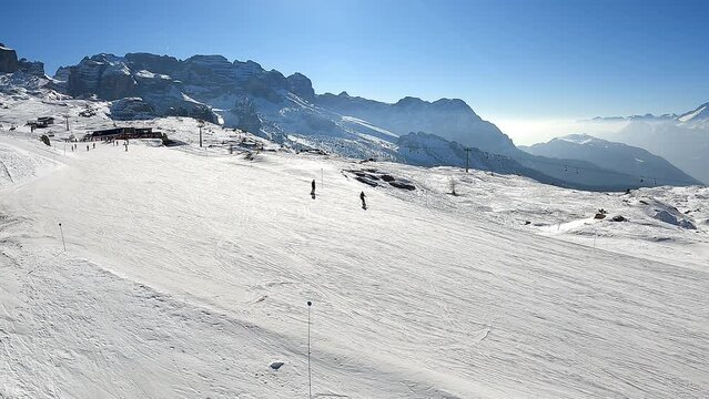 Madonna di Campiglio. Amazing aerial view at the ski slopes from the gondola lift reaching the top of the mountain. Italian Dolomites. Best of ski resort