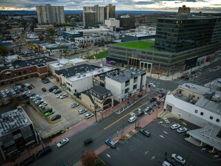 Aerial view of modern buildings and streets in Fort Lee, New Jersey at cloudy sunset