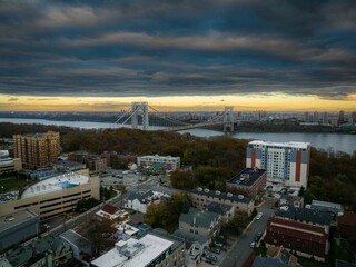 Aerial view of modern buildings and streets in Fort Lee, New Jersey at cloudy sunset