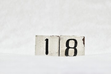 18 calendar date number, white winter background copy space