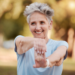 Happy old woman stretching in nature in fitness training, body exercise or workout for wellness balance. Smile, relaxing or face of healthy senior person exercising in a calm peaceful park in spring