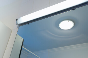 Sufficient light in the bathroom. Additional lamp above the bathroom mirror