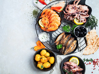 Various of seafood platter - prawn shrimp, squid, octopus mini, salmon, lobster.