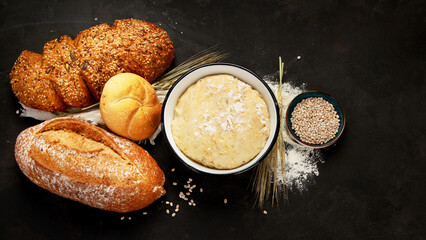 Bread assortment on dark background.